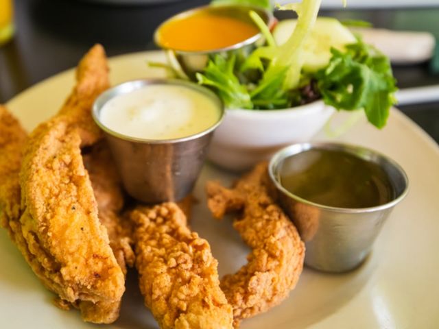 Illustrative photo of chicken fingers with dipping sauces