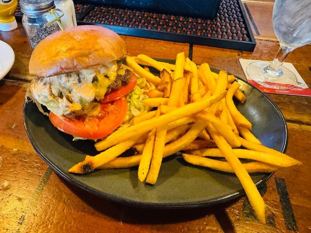 Illustrative photo of a burger with a pile of fries
